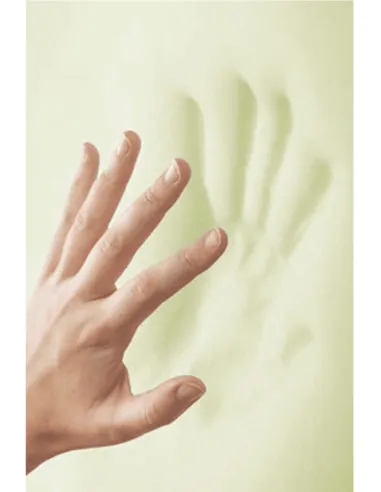 Hand pressing memory foam pillow, demonstrating its memory retention
