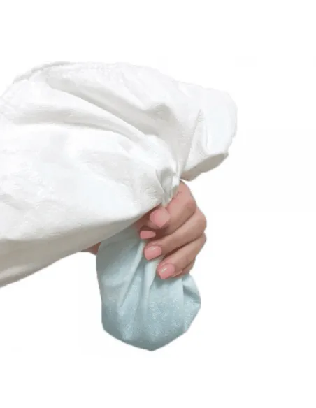 Hand demonstrating the flexibility and waterproofness of the Tencel mattress protector
