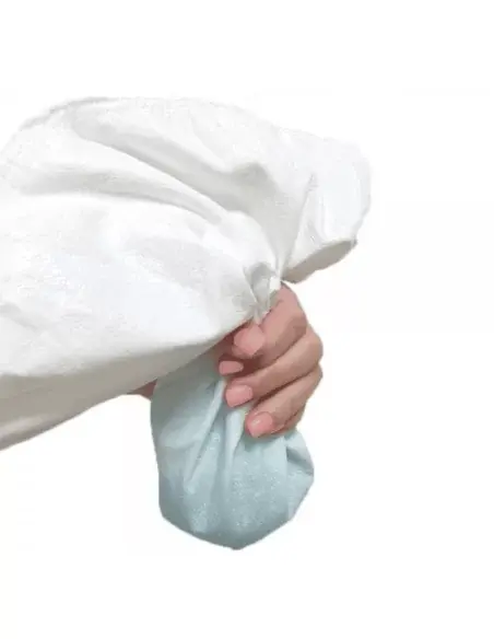 Hand demonstrating the flexibility and waterproofness of the Tencel mattress protector