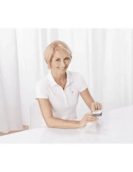 Woman using the Medisana PM100 Pulse Oximeter to measure blood oxygen levels