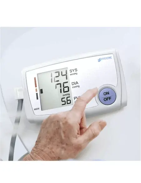 Person using the FASTOME blood pressure monitor to measure blood pressure