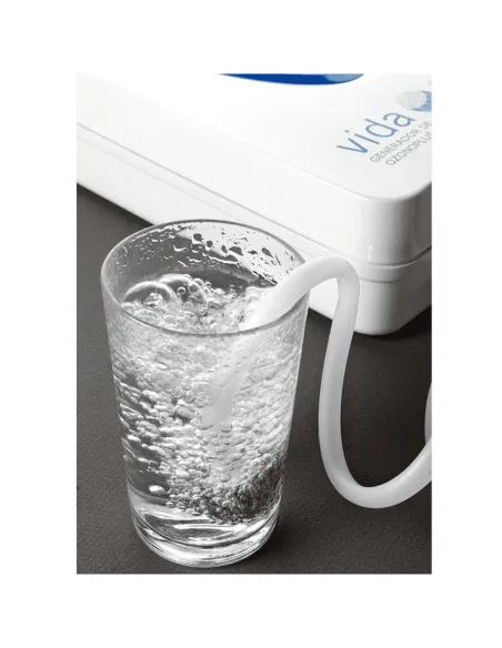 Care-Life Ozone Generator purifying water in a glass using a diffuser tube