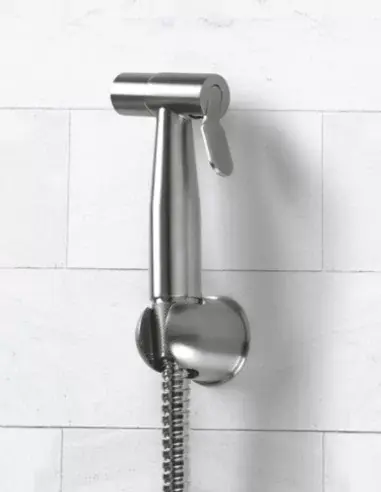 Fastome ozone tap installed on the wall with flexible hose